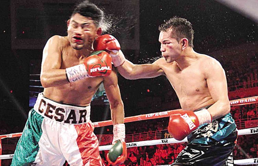 BACK IN A FLASH  Nonito Donaire  lands a crushing right to the face of Mexican opponent Cesar Juarez during their World Boxing Organization super bantamweight title fight in Coliseo Roberto Clemente in San Juan, Puerto Rico, on Friday. The Filipino Flash hammered out a tough unanimous decision over Juarez in what he described as the toughest fight of his life to regain the title he lost two years ago. PHOTO FROM TOP RANK BOXING FACEBOOK PAGE