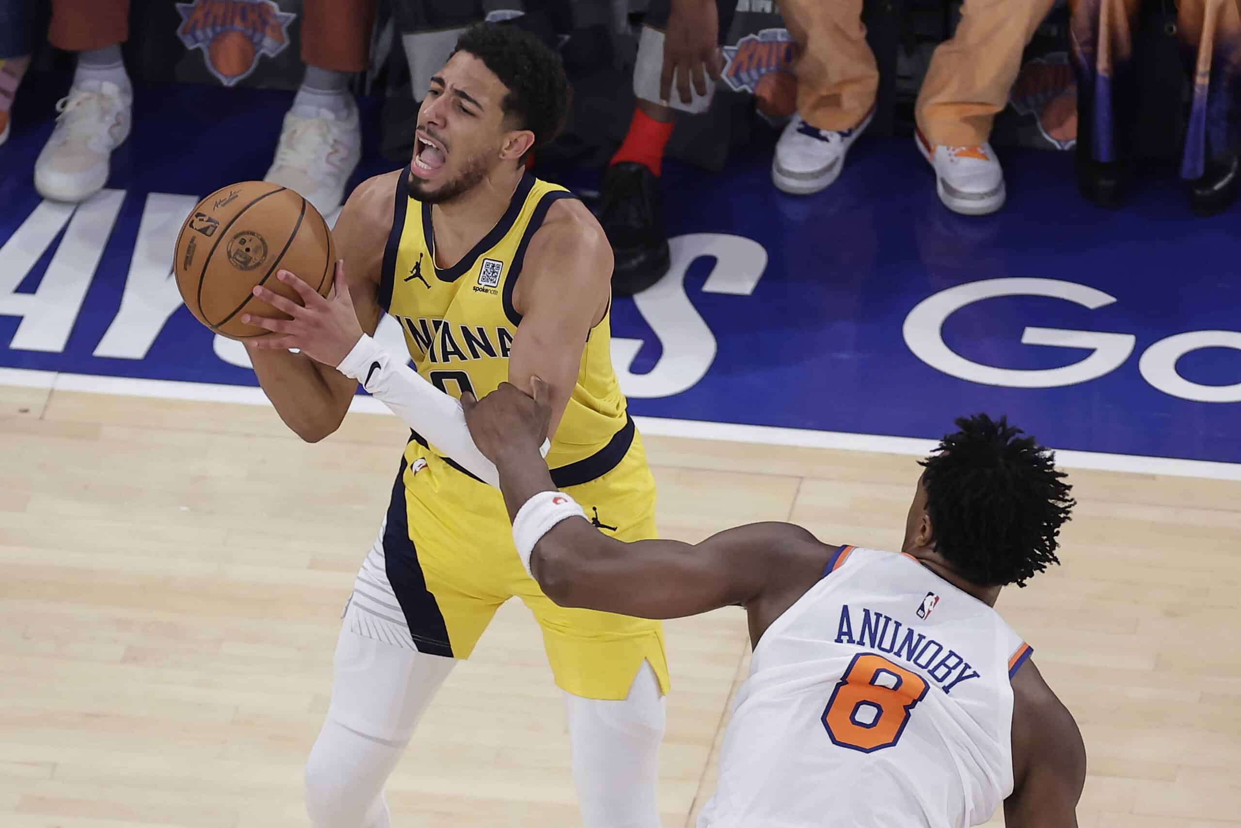 Indiana Pacers guard Tyrese Haliburton (0) is fouled by New York Knicks forward OG Anunoby (8) during the first quarter of Game 5 of the NBA basketball Eastern Conference final, Thursday, May 29, 2025, in New York.